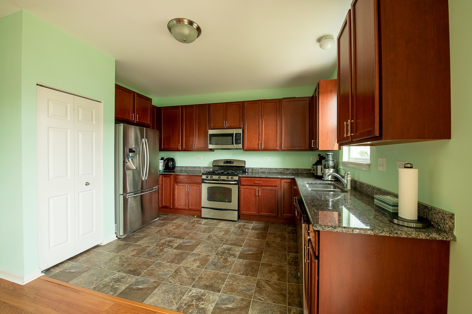 2692 Reedgrass Way Wauconda, IL 60084 - Photo 5 of 22 a kitchen with stainless steel appliances granite countertop a refrigerator stove top oven a sink and dishwasher