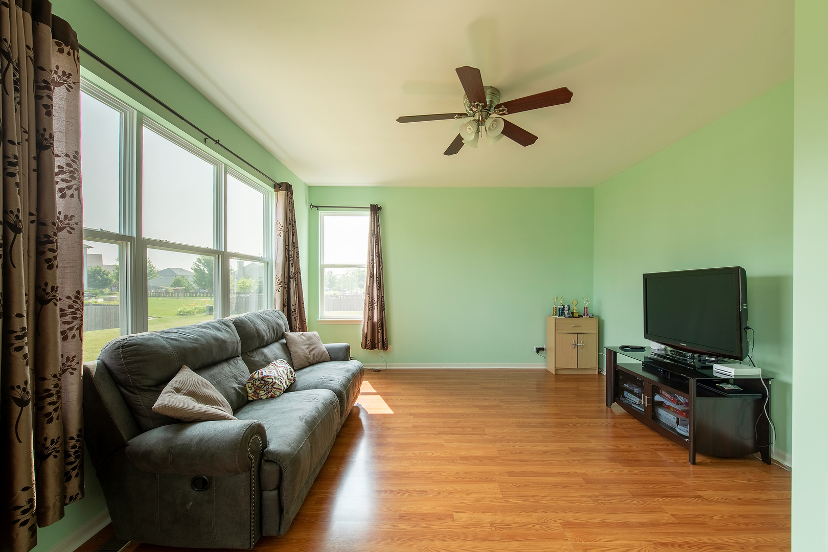 2692 Reedgrass Way Wauconda, IL 60084 - Photo 8 of 22 a living room with furniture and a flat screen tv