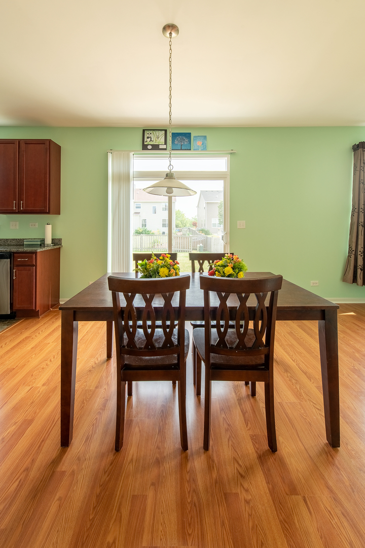 2692 Reedgrass Way Wauconda, IL 60084 - Photo 9 of 22 a view of a dining room with furniture window and wooden floor