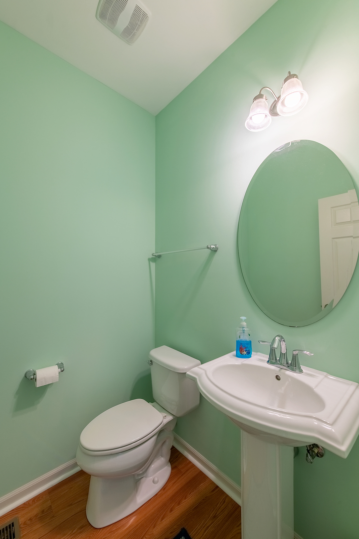2692 Reedgrass Way Wauconda, IL 60084 - Photo 10 of 22 a bathroom with a sink and a mirror