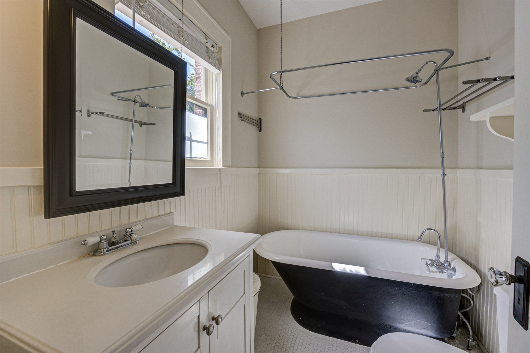 1001 Bomar Street, Unit B Houston, TX 77006 - Photo 13 of 19 a bathroom with a sink a toilet and mirror