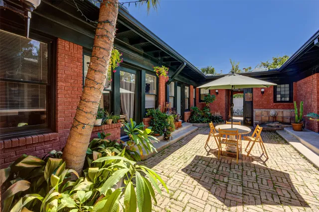 a view of a chairs and table in the patio
