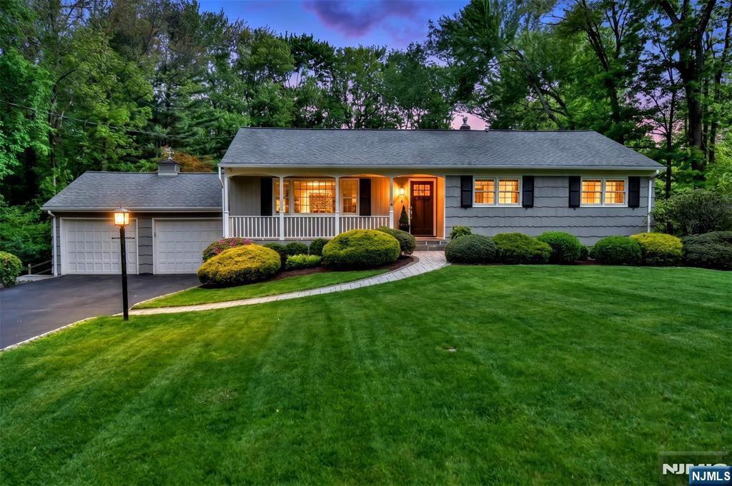 60 Dimmig Road Upper Saddle River, NJ 07458 - Photo 2 of 40 a front view of a house with a garden