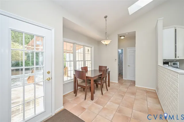 a view of a kitchen and dining table chairs