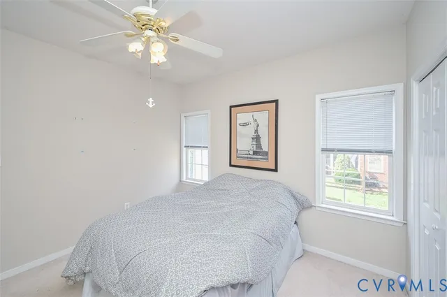 a bathroom with a toilet a sink and a mirror
