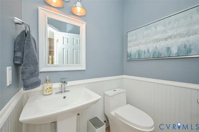 a utility room with a sink washer and dryer