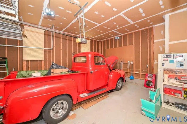 a view of a grassy field with trees in the background