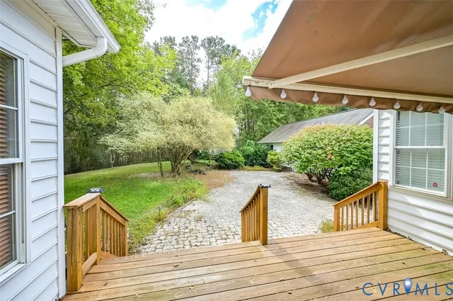 a view of a balcony with yard