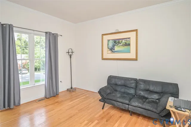 a view of room with furniture and window