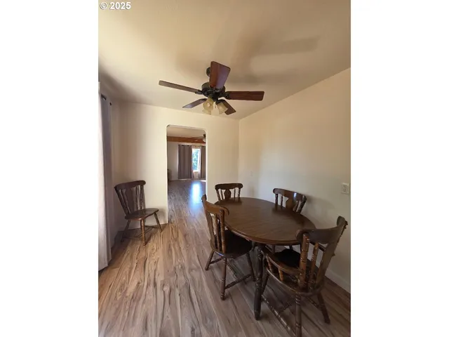 a kitchen with granite countertop stainless steel appliances cabinets a sink and a large window