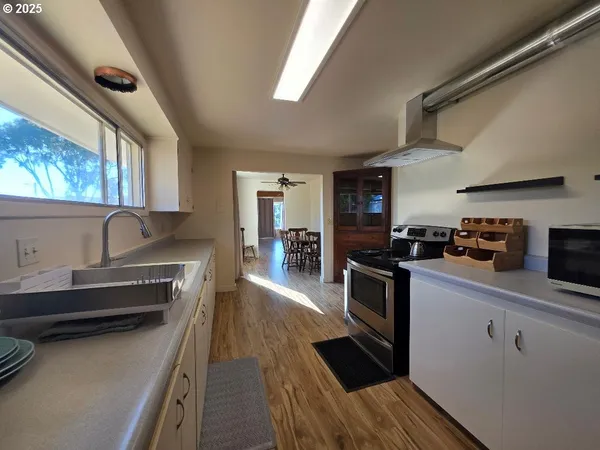 a kitchen with granite countertop lots of counter top space and stainless steel appliances