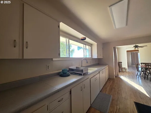 a kitchen with granite countertop a stove and a refrigerator