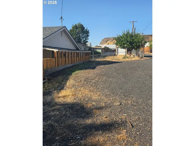 a view of a living room with a sink and cabinets