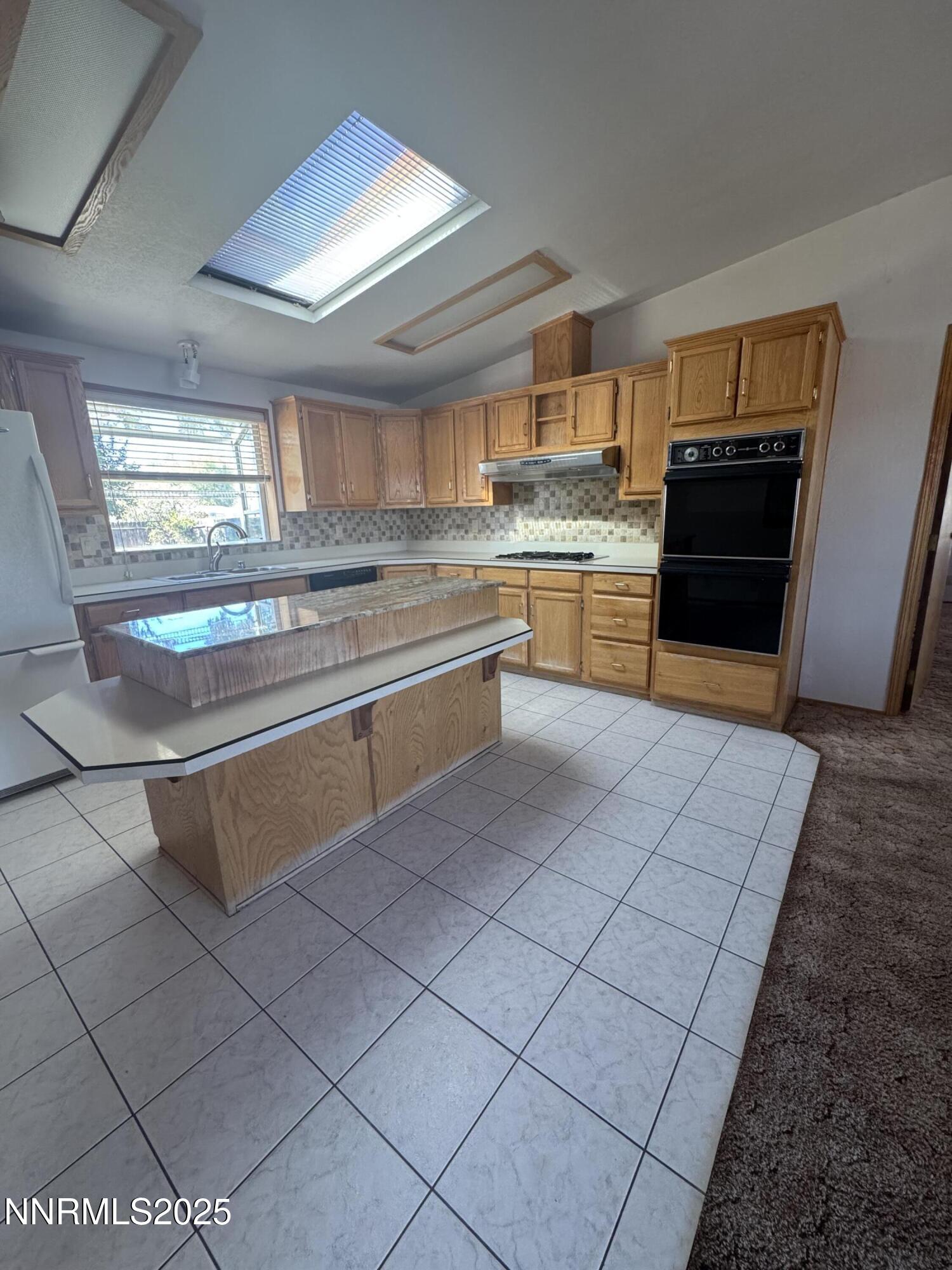 3255 Upper Valley Road Lovelock, NV 89419 - Photo 11 of 28 a kitchen with stainless steel appliances granite countertop a sink and cabinets