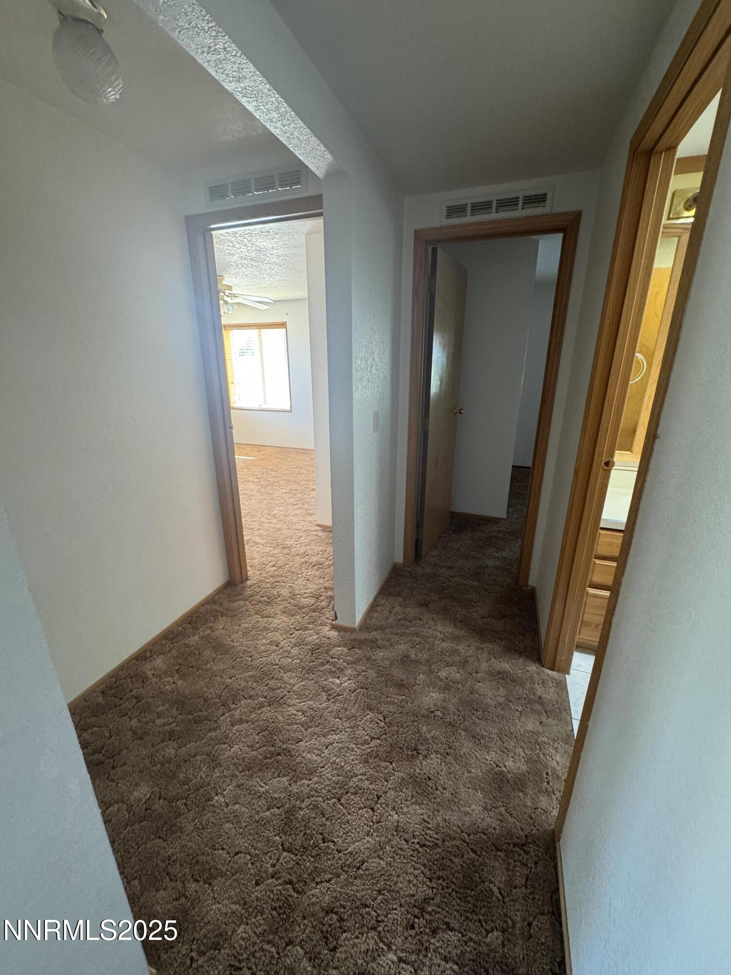 3255 Upper Valley Road Lovelock, NV 89419 - Photo 12 of 28 a view of a hallway with windows