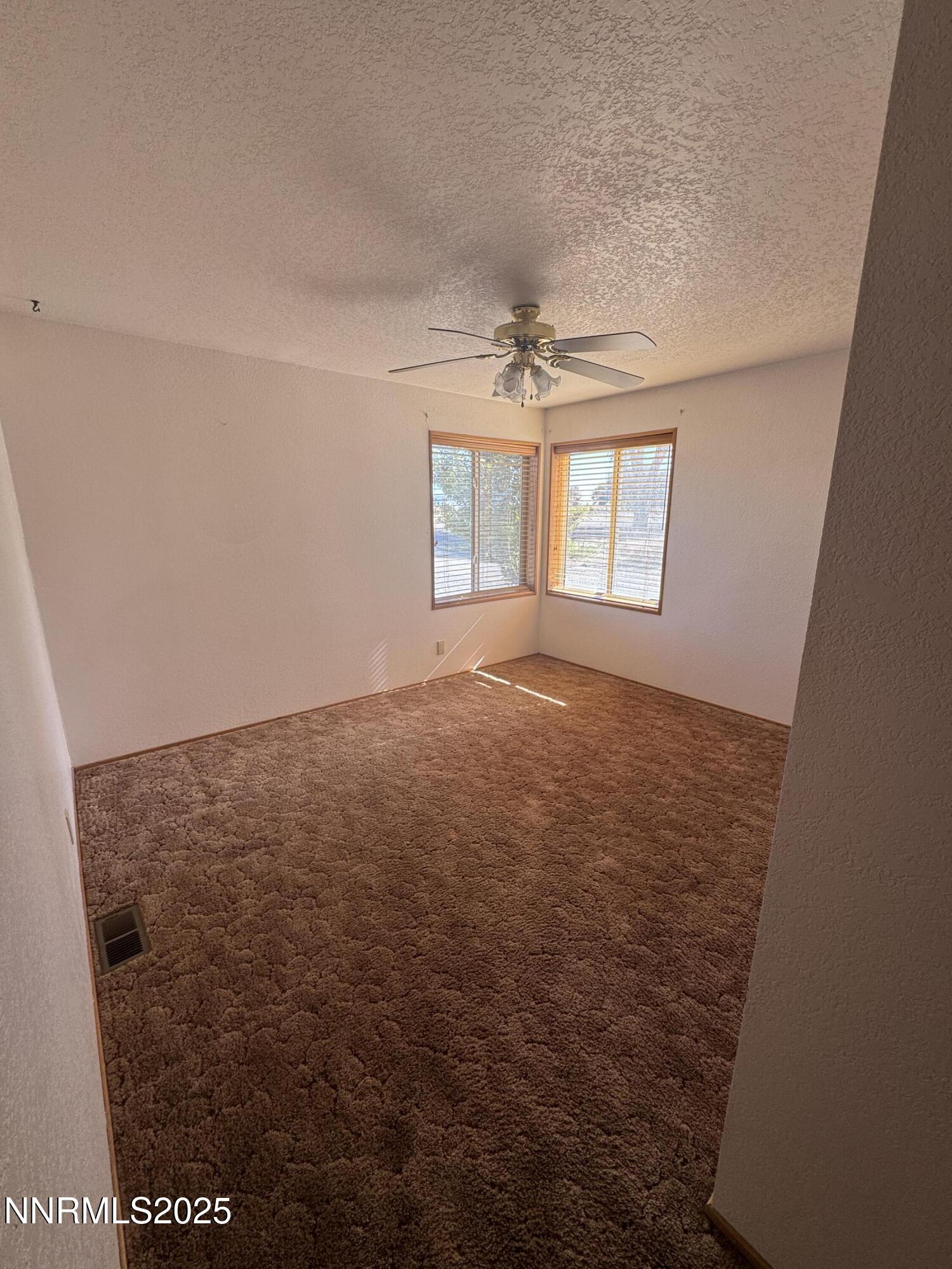 3255 Upper Valley Road Lovelock, NV 89419 - Photo 13 of 28 an empty room with windows and closet
