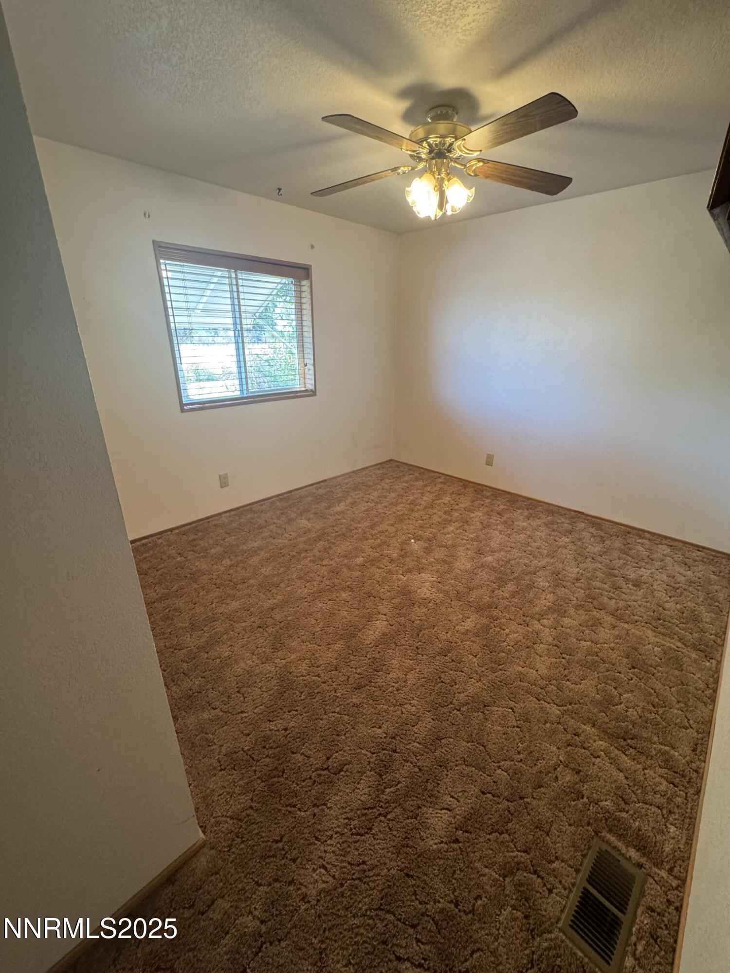 3255 Upper Valley Road Lovelock, NV 89419 - Photo 14 of 28 a view of an empty room and chandelier fan