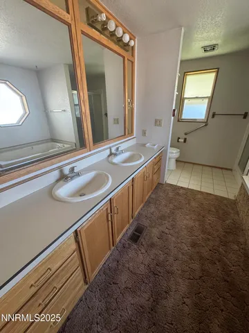 a room with pool table and windows