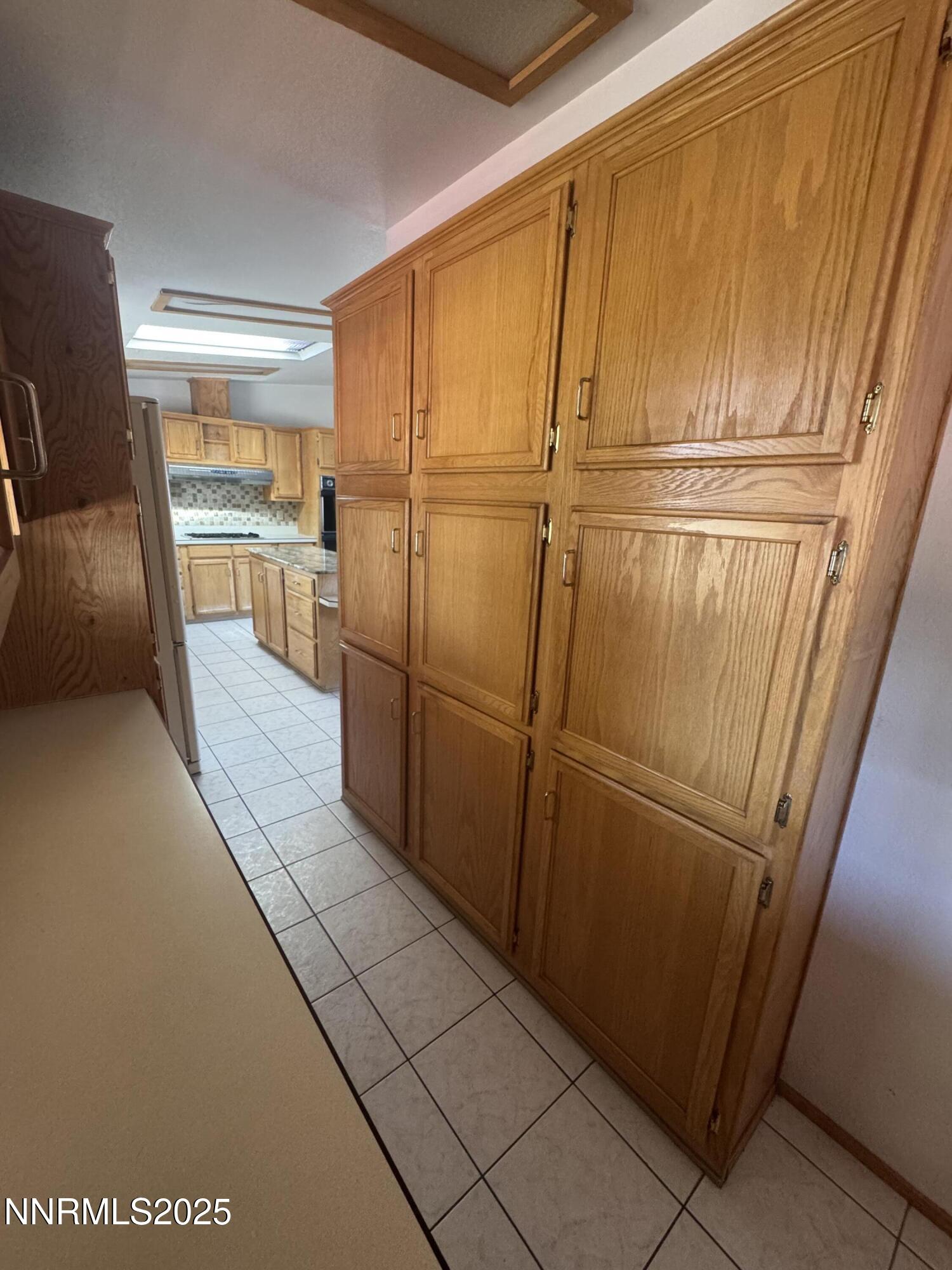 3255 Upper Valley Road Lovelock, NV 89419 - Photo 25 of 28 a view of a refrigerator in kitchen and wooden floor