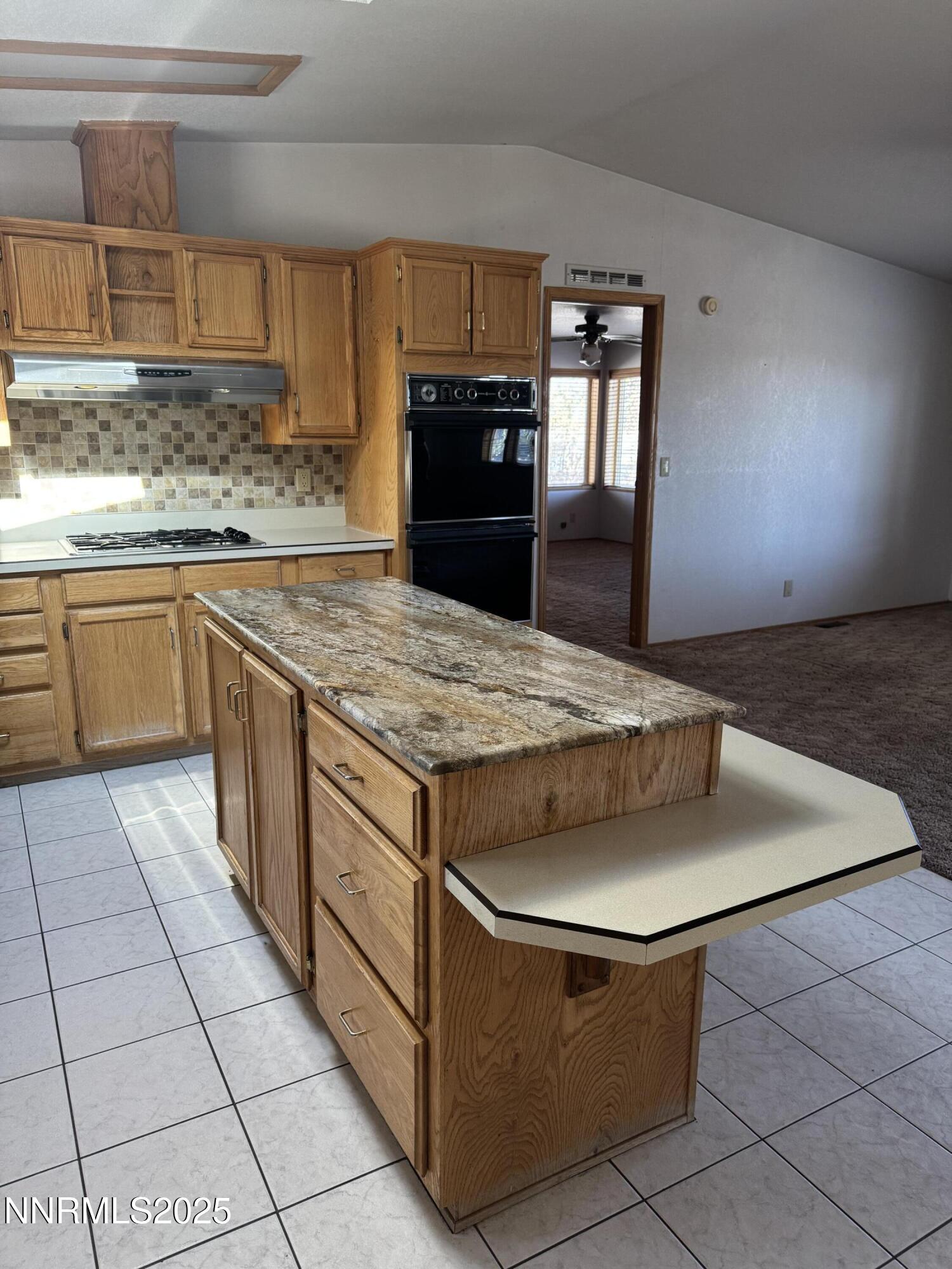 3255 Upper Valley Road Lovelock, NV 89419 - Photo 7 of 28 a kitchen with stainless steel appliances granite countertop a stove a sink and a microwave