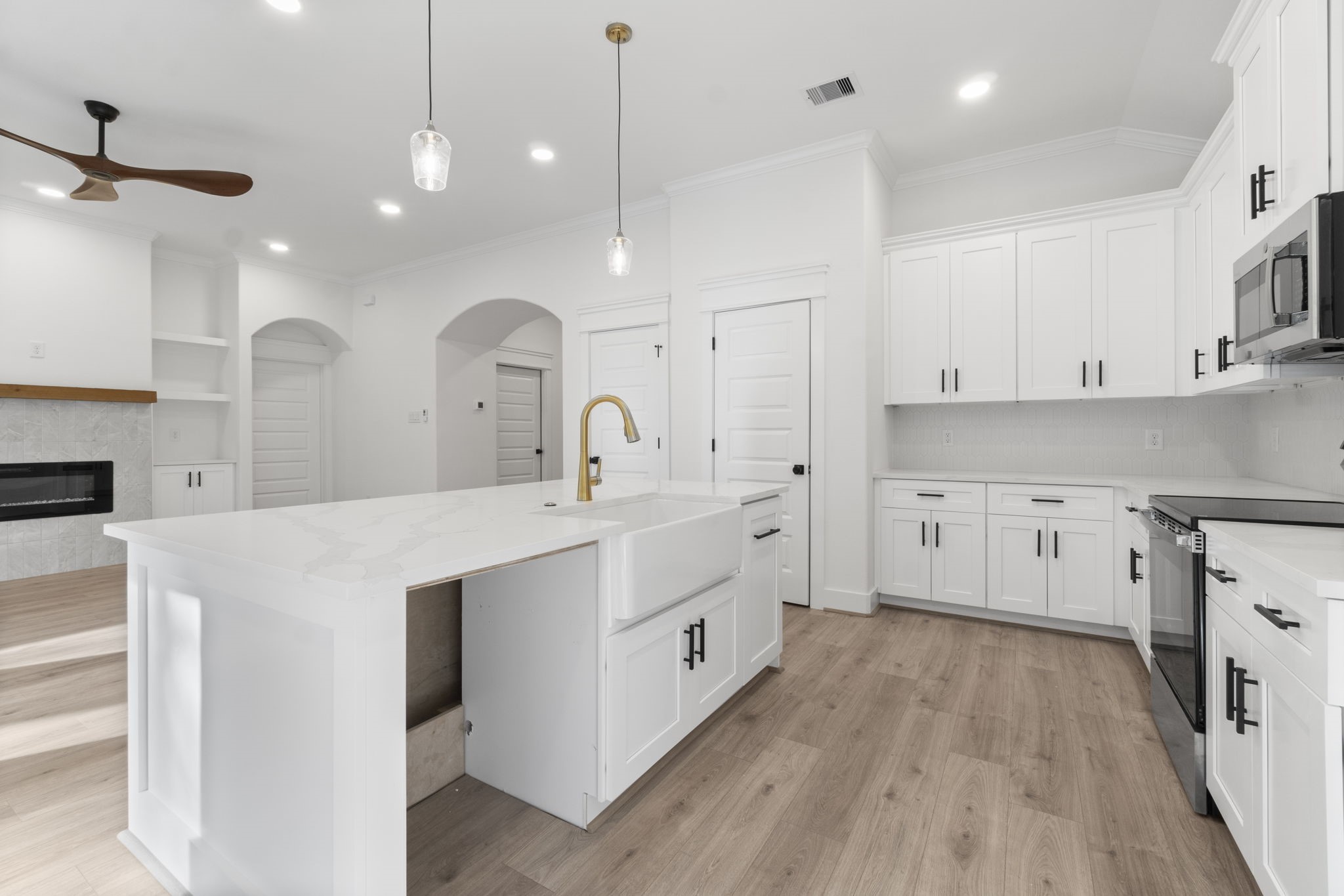 241 Clear Springs Trinity, TX 75862 - Photo 12 of 46 a large kitchen with cabinets a sink a window and a stainless steel appliances