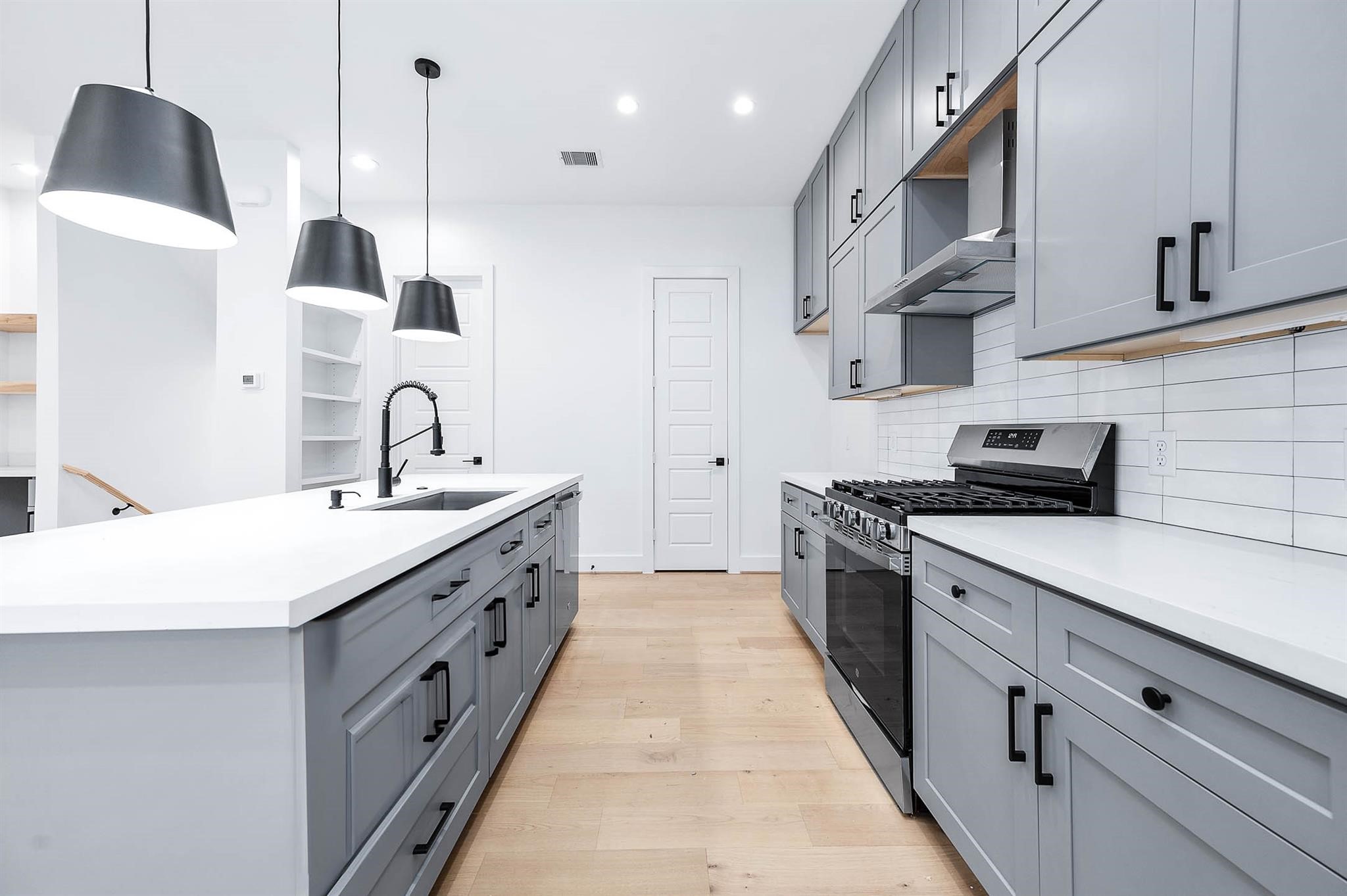 1705 Milby Street Houston, TX 77003 - Photo 4 of 12 a kitchen with a sink and cabinets