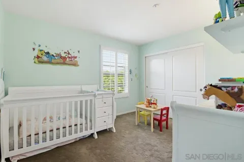 a bedroom with furniture and a window