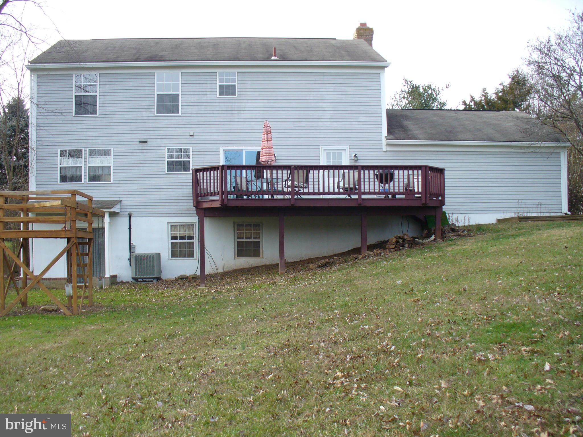 14331 Twig Road Silver Spring, MD 20905 - Photo 2 of 27 a view of a house with a yard and sitting area