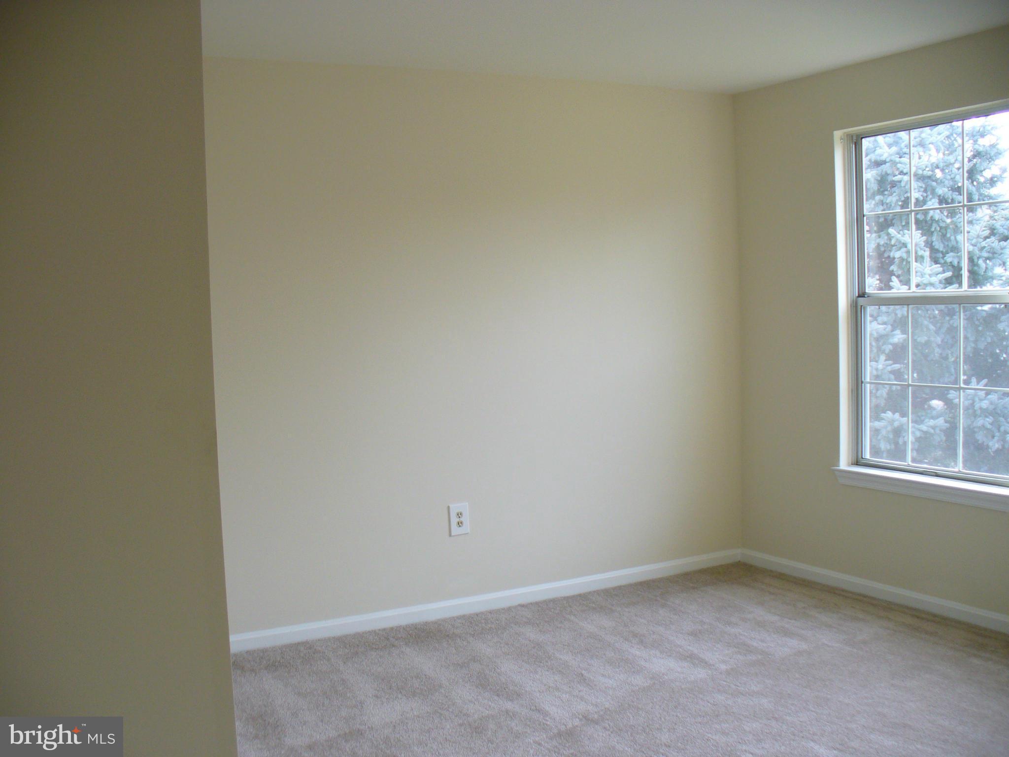 14331 Twig Road Silver Spring, MD 20905 - Photo 20 of 27 an empty room with windows