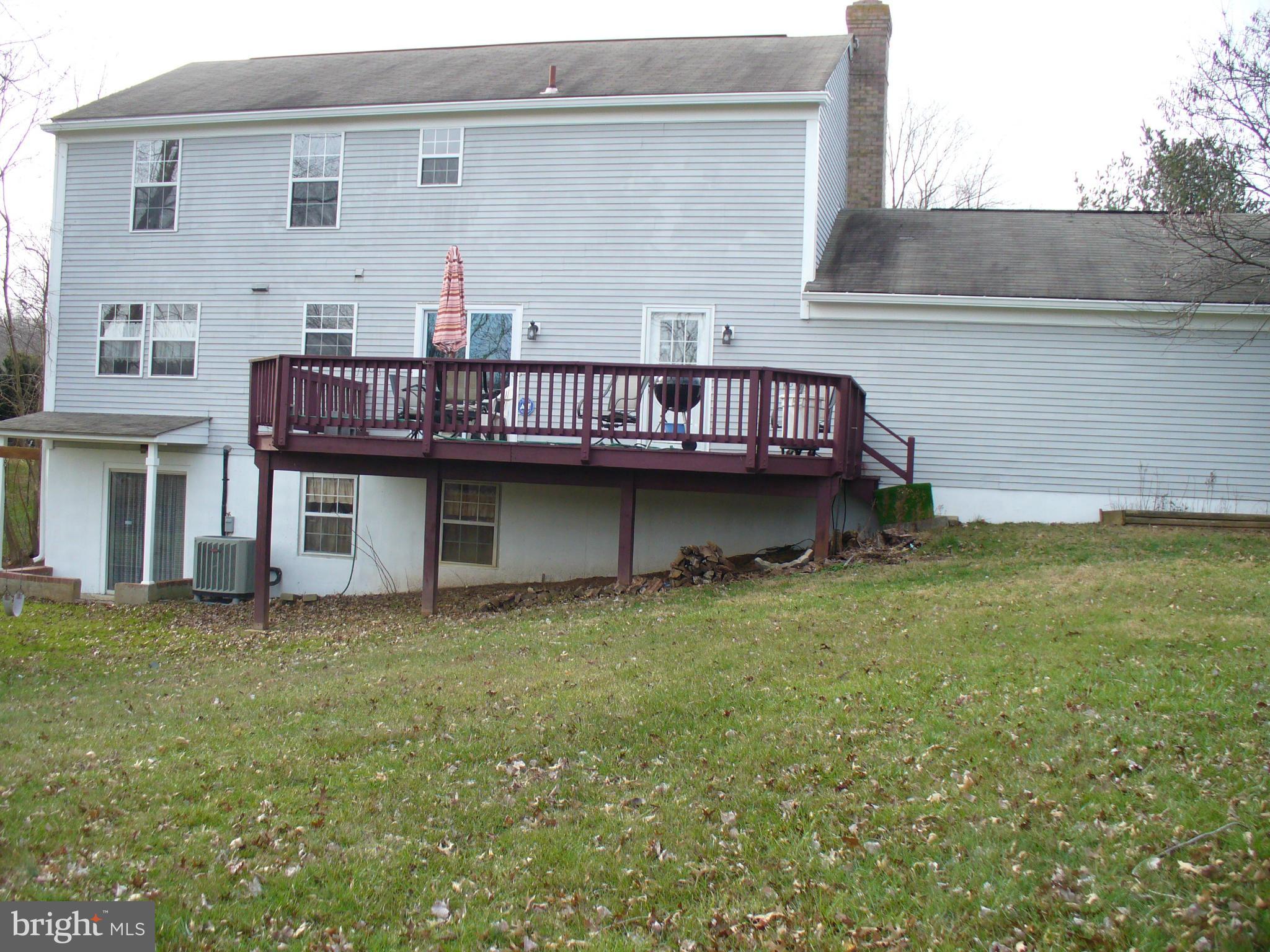 14331 Twig Road Silver Spring, MD 20905 - Photo 3 of 27 a view of a house with a roof deck