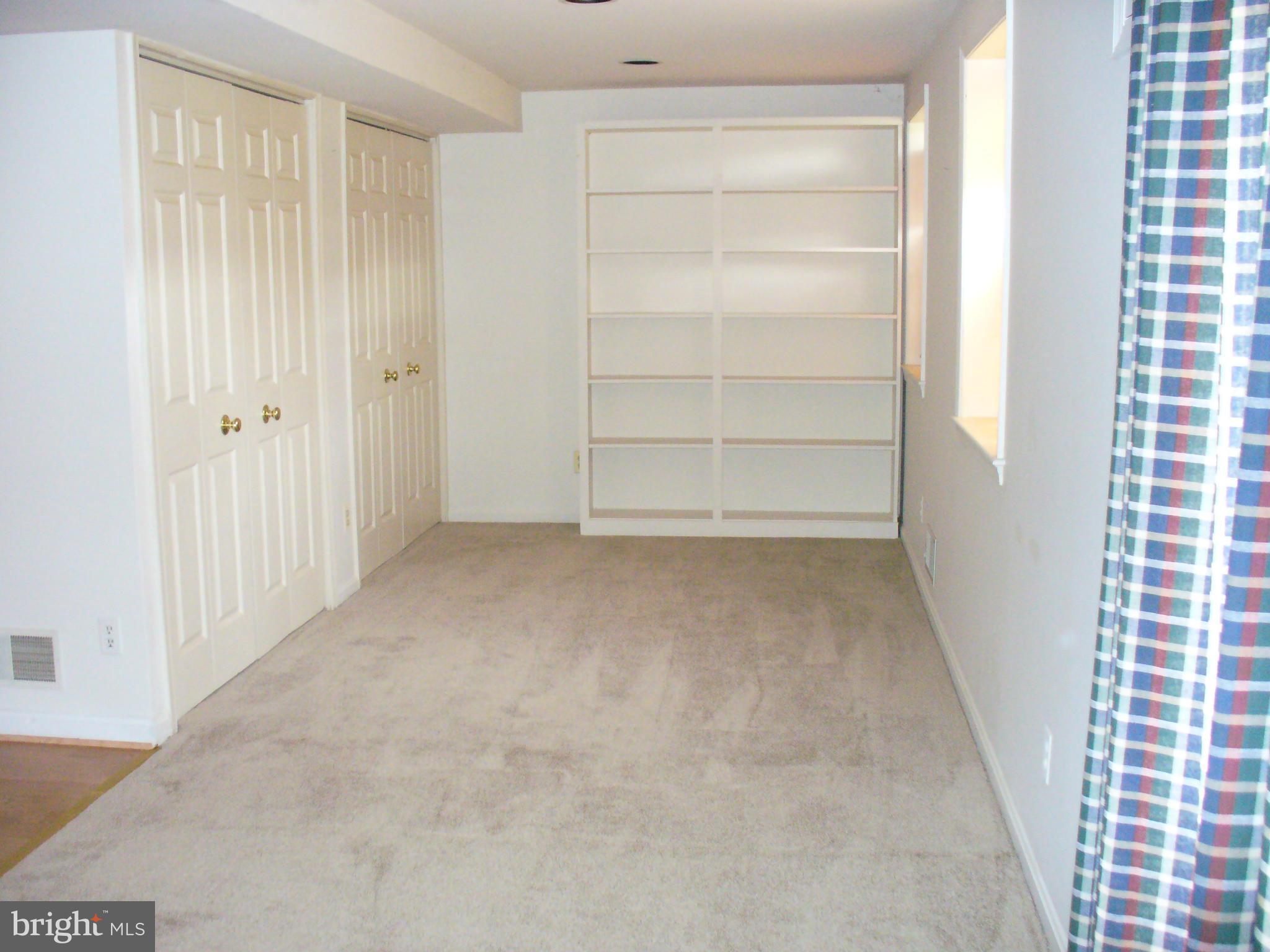14331 Twig Road Silver Spring, MD 20905 - Photo 25 of 27 a view of an empty room with a window