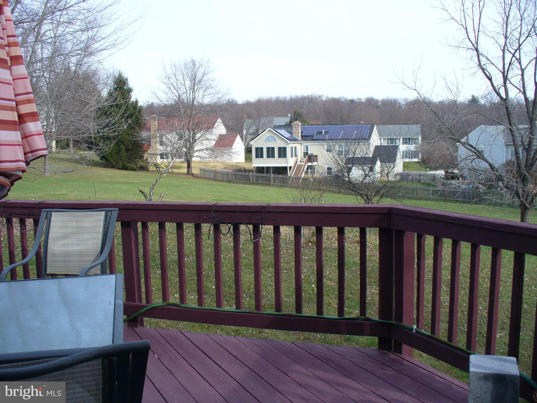 14331 Twig Road Silver Spring, MD 20905 - Photo 4 of 27 a balcony with wooden floor and city view