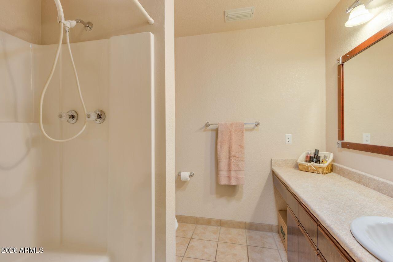 949 Rabbit Run Clarkdale, AZ 86324 - Photo 16 of 46 a bathroom with a sink and a mirror