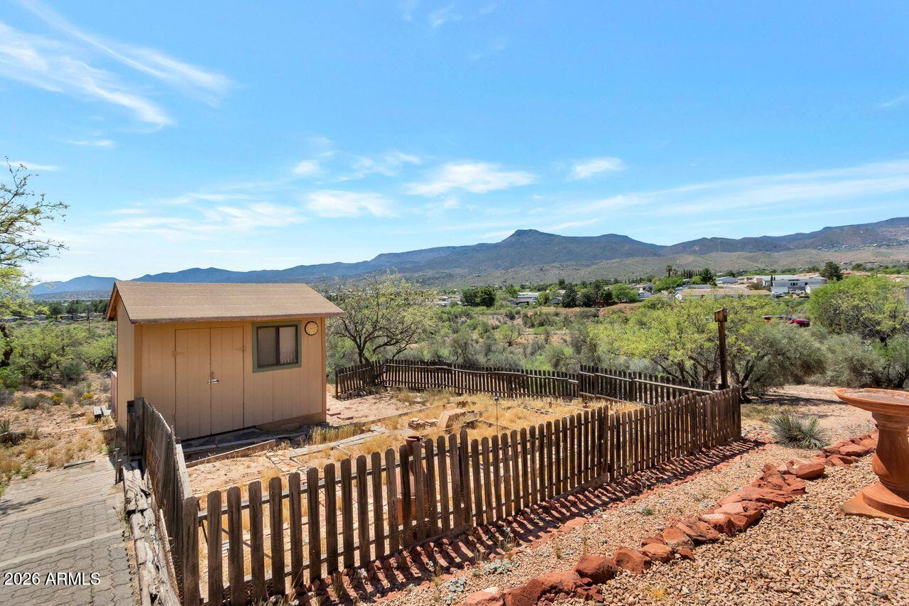 949 Rabbit Run Clarkdale, AZ 86324 - Photo 24 of 46 a view of a street with a wooden fence