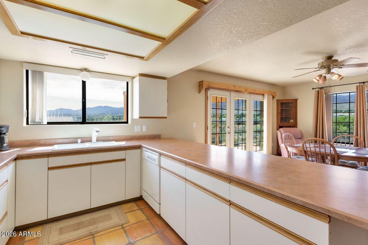 949 Rabbit Run Clarkdale, AZ 86324 - Photo 6 of 46 a kitchen with a sink and large window