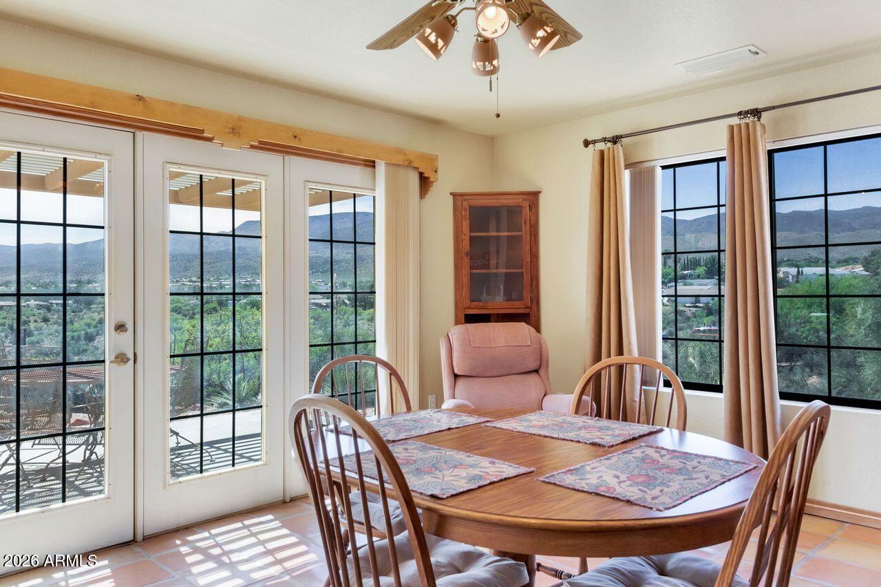 949 Rabbit Run Clarkdale, AZ 86324 - Photo 8 of 46 a view of a dining room with furniture window and wooden floor