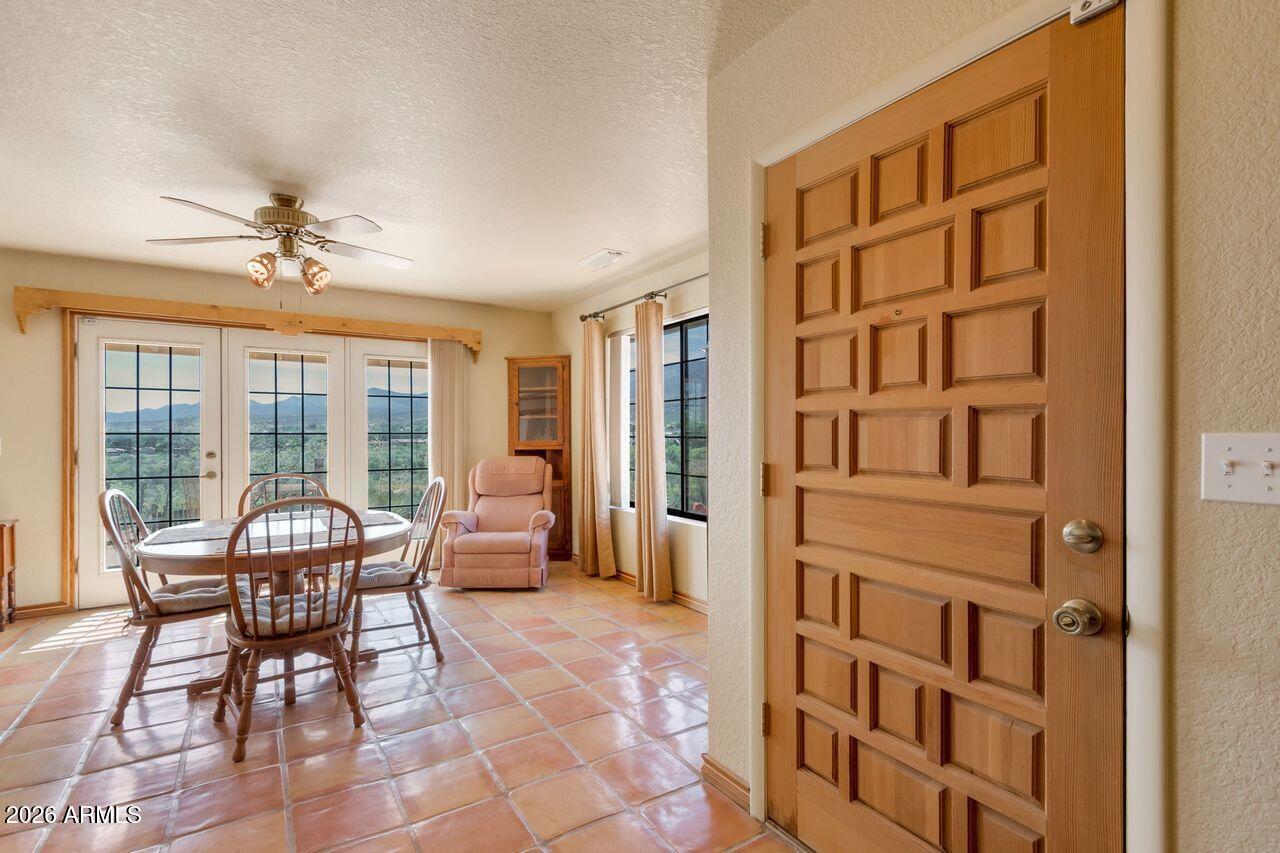 949 Rabbit Run Clarkdale, AZ 86324 - Photo 9 of 46 a dining room with furniture and a floor to ceiling window