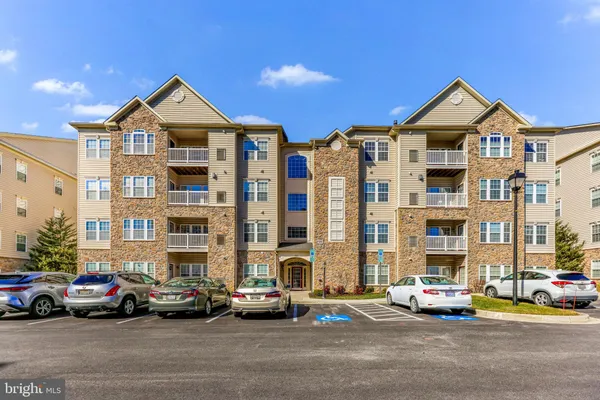 a view of a street with cars and buildings
