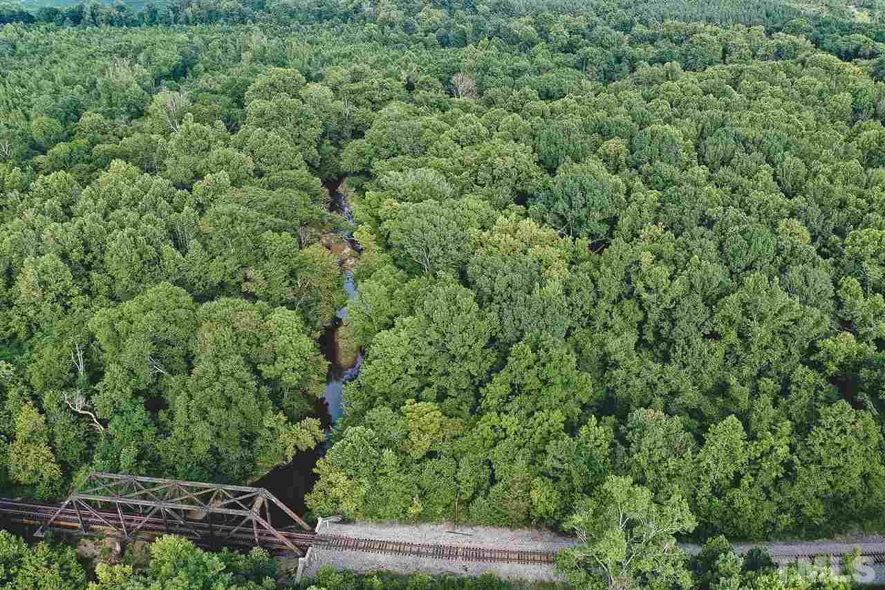 210.5-ac Woodsdale Road Roxboro, NC 27574 - Photo 14 of 30 a view of a forest with a street