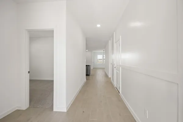 a view of a hallway with a room