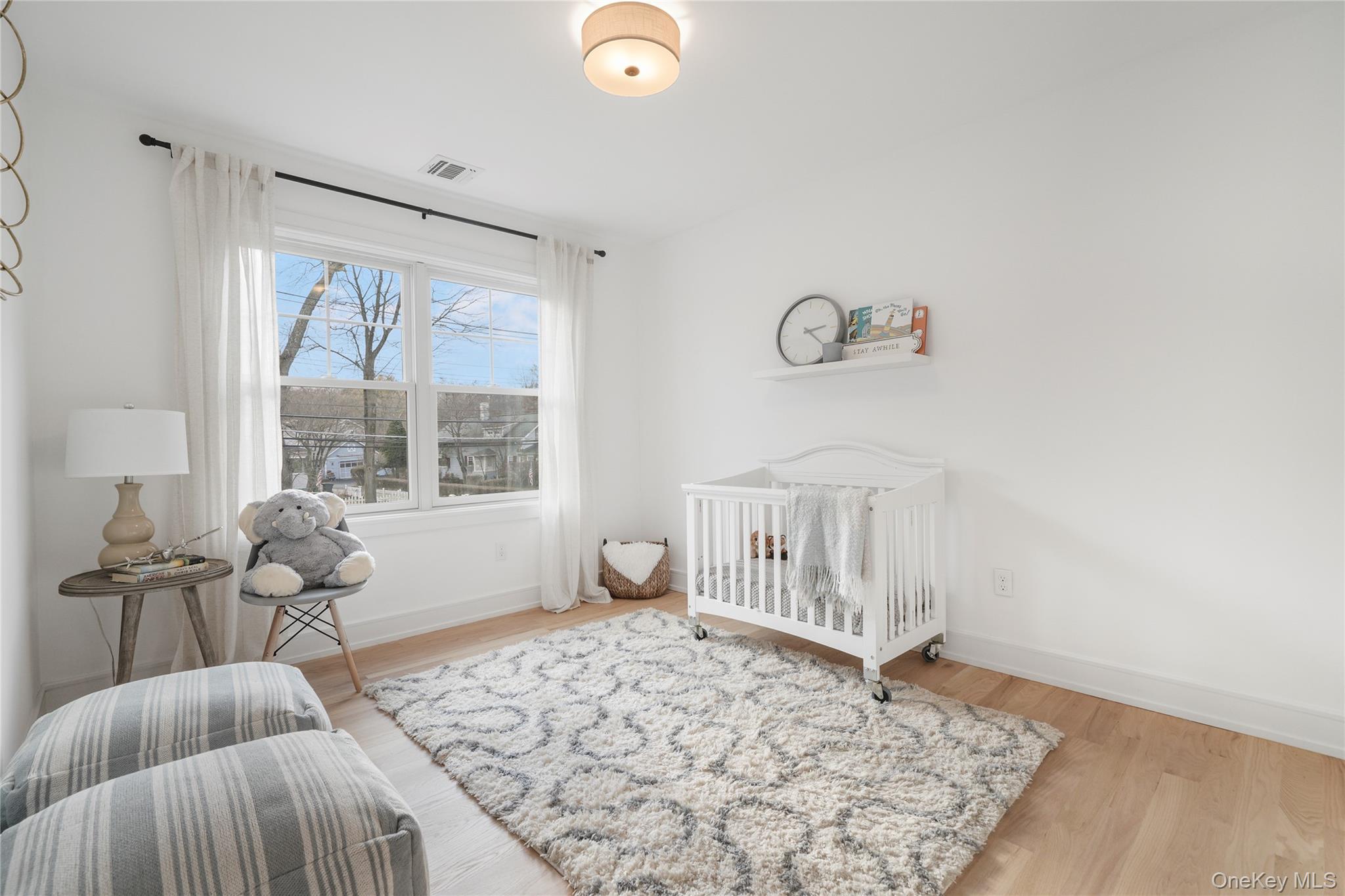 2040 Crompond Road, Unit 22 Yorktown Heights, NY 10598 - Photo 15 of 19 Bedroom featuring a nursery area and light hardwood / wood-style floors