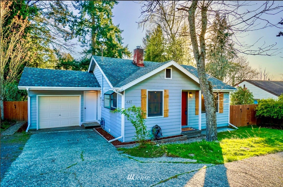 448 Windsor Way Northeast Renton, WA 98056 - Photo 2 of 20 a front view of a house with a yard and garage