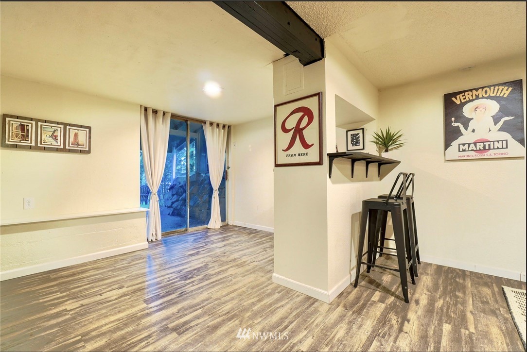 448 Windsor Way Northeast Renton, WA 98056 - Photo 11 of 20 a view of a hallway with wooden floor