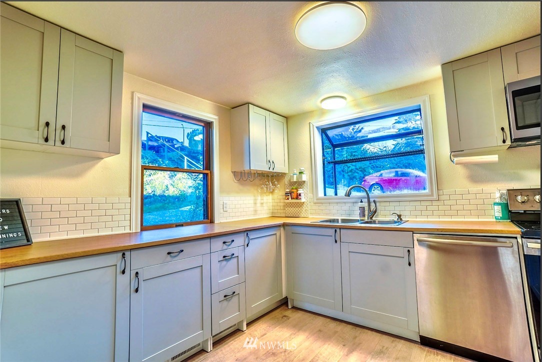 448 Windsor Way Northeast Renton, WA 98056 - Photo 5 of 20 a kitchen with sink and window