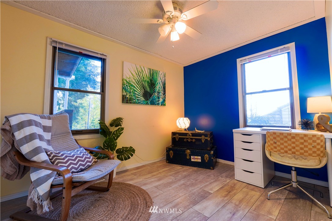 448 Windsor Way Northeast Renton, WA 98056 - Photo 9 of 20 a living room with furniture and a window