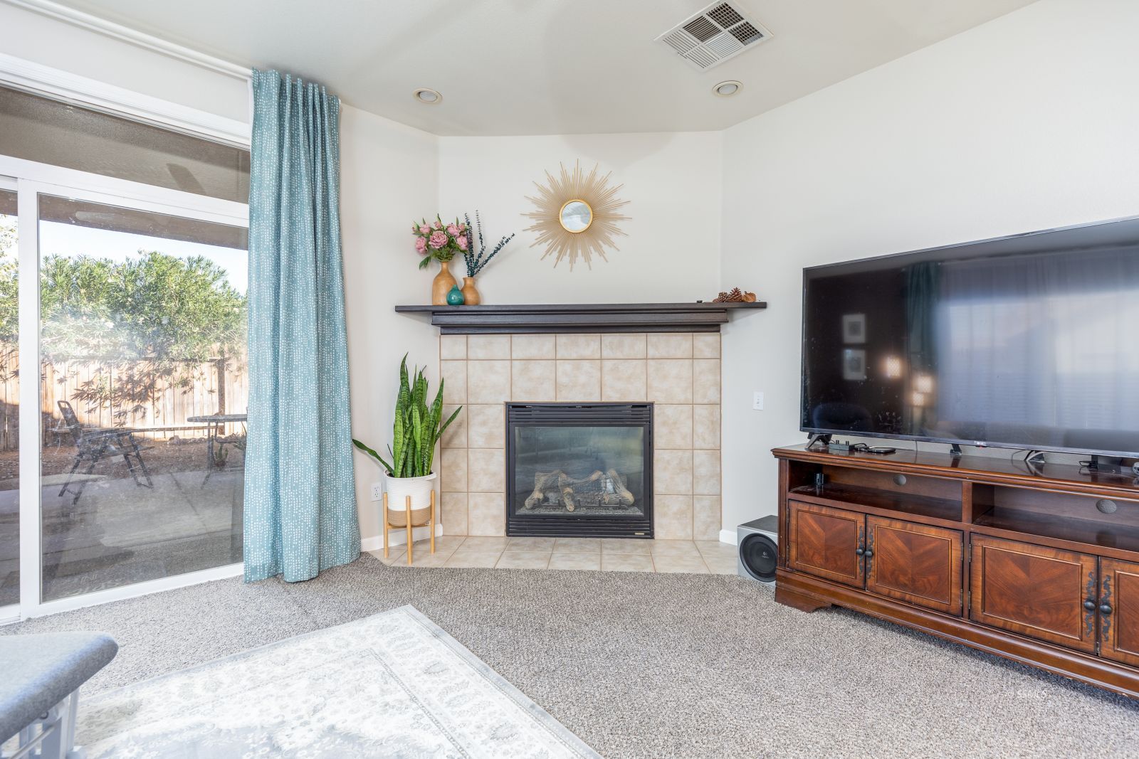648 Pinon Court Ridgecrest, CA 93555 - Photo 10 of 35 a living room with furniture and a fireplace