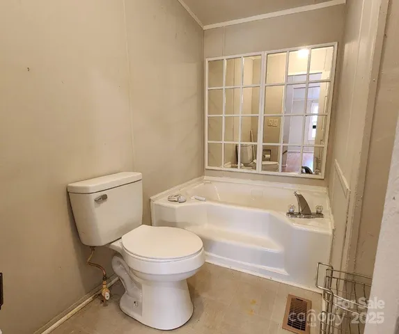 a bathroom with a toilet a sink and a bathtub
