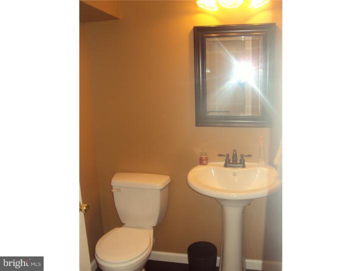 706 Farmhouse Road Mickleton, NJ 08056 - Photo 13 of 24 a bathroom with a toilet sink and mirror