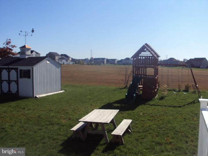 706 Farmhouse Road Mickleton, NJ 08056 - Photo 19 of 24 a view of a table and chairs in the garden