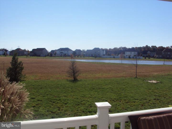 706 Farmhouse Road Mickleton, NJ 08056 - Photo 20 of 24 a view of a lake from a yard